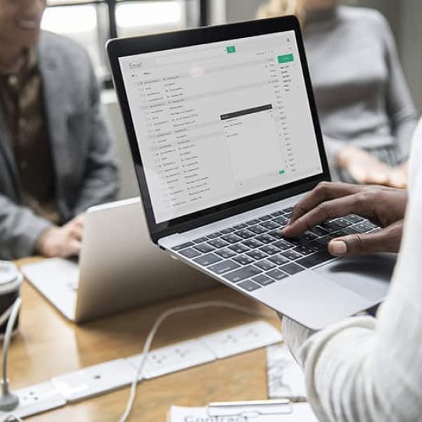 Man checking his email on a laptop