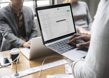 Man checking his email on a laptop